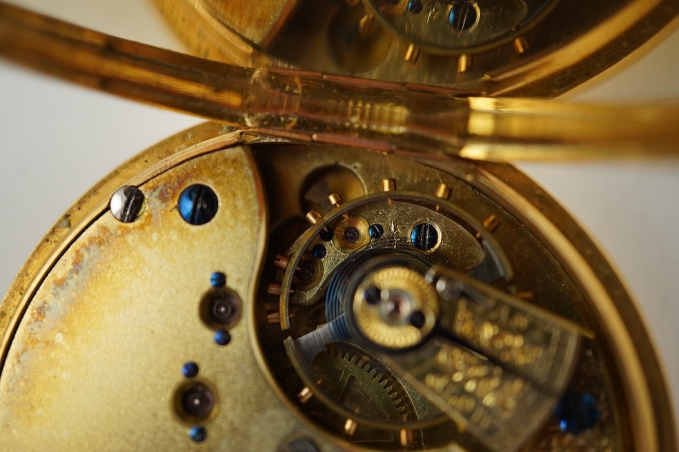 A continental 18k gold open faced keyless lever pocket watch, with a 9ct albert